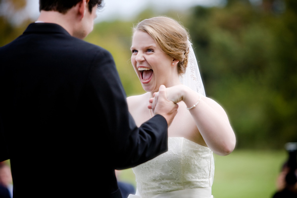 happy bride laughing with her groom - photo by North Carolina based wedding photographers Cunningham Photo Artists